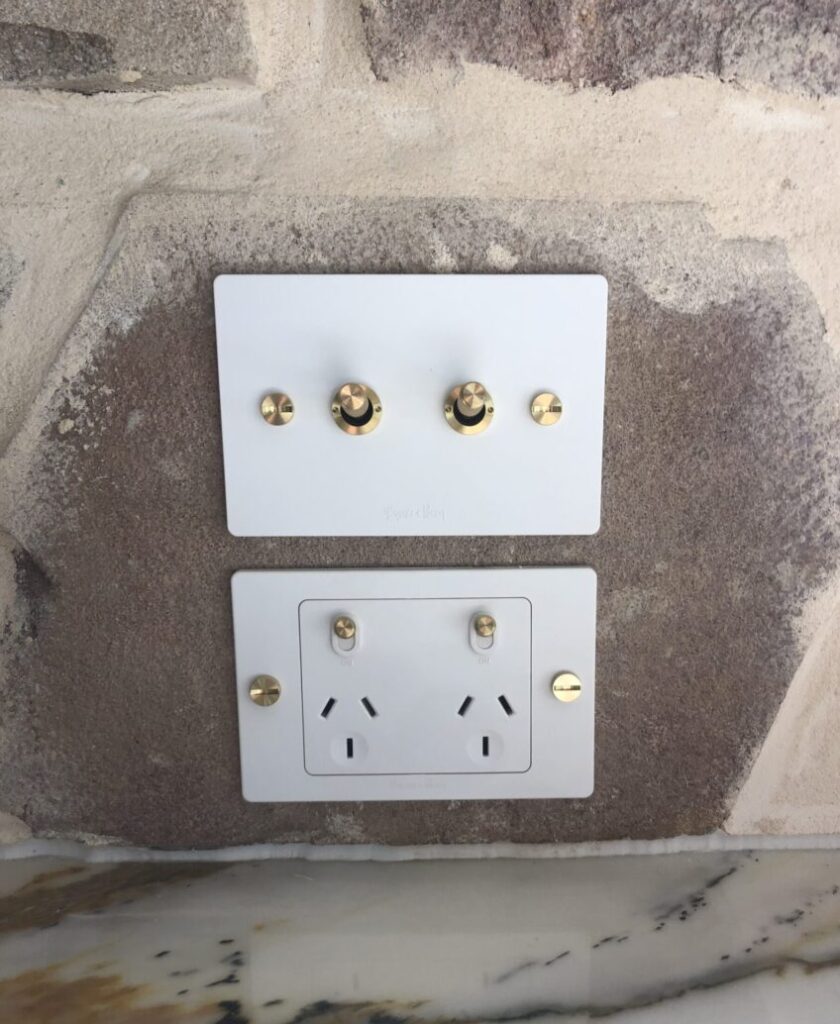 Home Electrician installed switches into a stone wall with precision