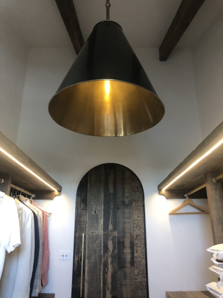 Home Electrician installed LED strip lighting with feature light in a closet