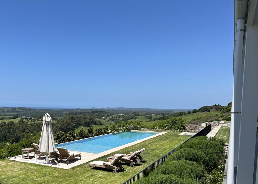 Home View from residential job site with pool and surrounding landscape